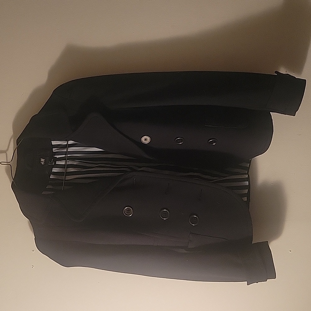 H&m Women's black blazer. Size 2. Black and white printed inside.